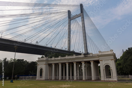 The iconic ancient colonial architecture with Vidyasagar bridge famous land mark of Kolkata, India. photo