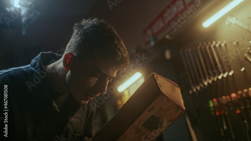 Valokuva Young blacksmith man with welding shield using welding machine for welding metal