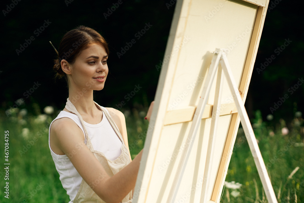 woman artist paints a picture near easel outdoors landscape creative woman artist paints a picture near easel outdoors landscape creative