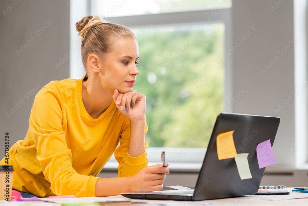 Workplace of freelance worker or a student girl at home office. Young woman works using computer and other devices. Remote job concept. Workplace of freelance worker or a student girl at home office. Young woman works using computer and other devices. Remote job concept.