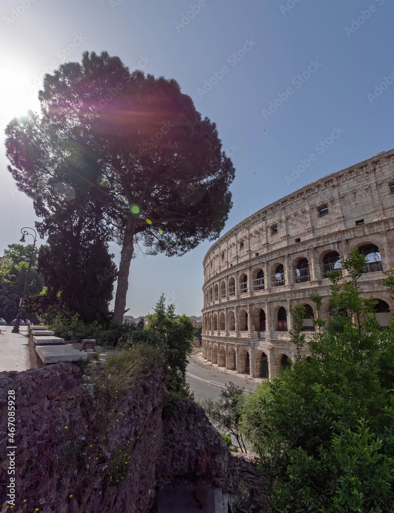 Rome Italy, view of the famous Colosseum amphitheater with impressive lens flare