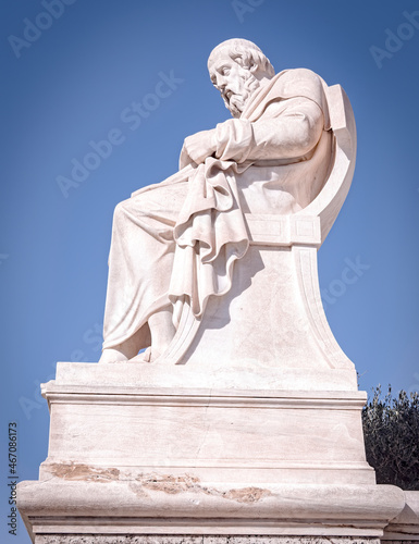 Plato the ancient Greek philosopher statue under blue sky, Athens Greece photo