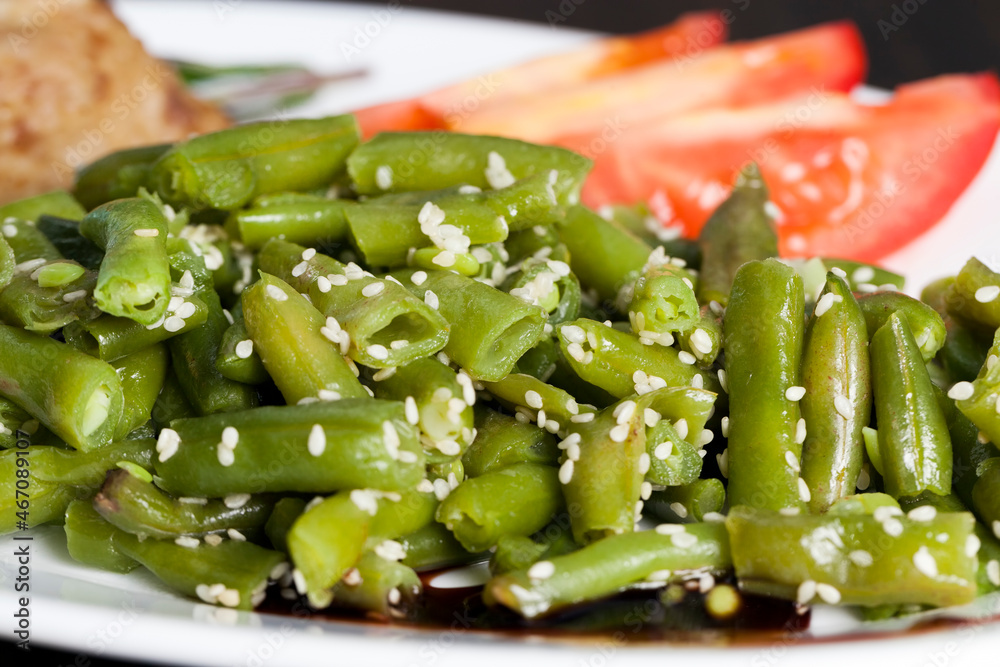 baked asparagus beans with sesame seeds and meat cutlet