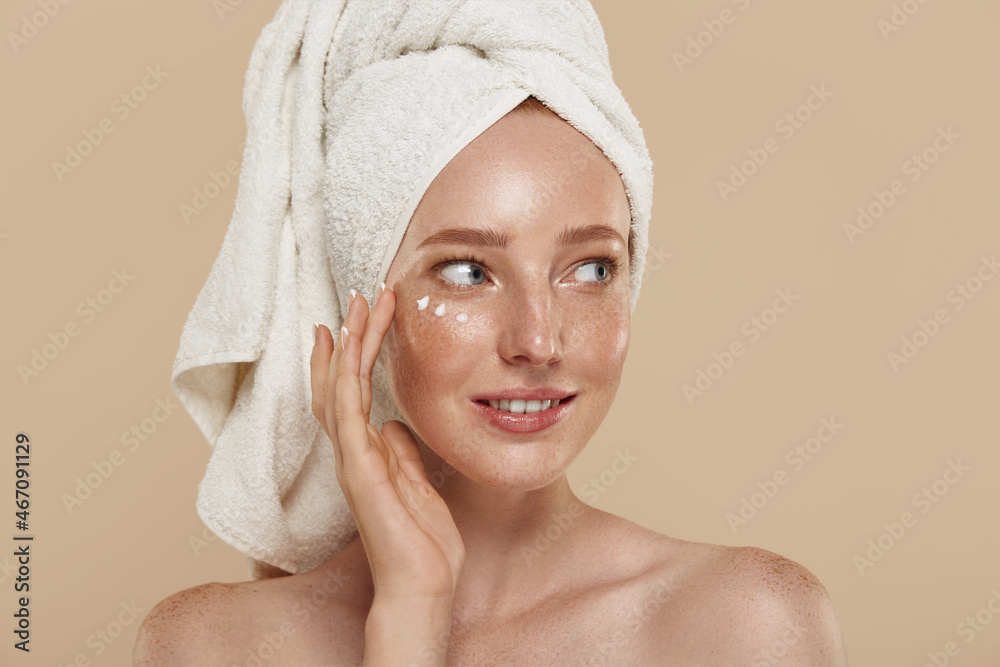 Girl with undereye patches and towel on head Girl with undereye patches and towel on head