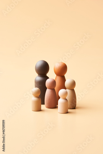 Children figurines near heterosexual parents