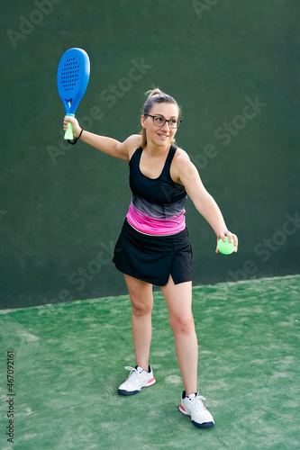 Sportswoman preparing to play padel