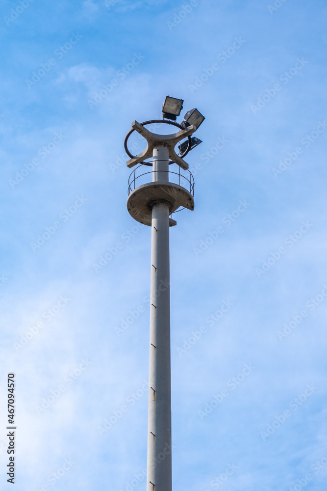 street lamp, lighting equipment. concrete electric pole. metal ladder