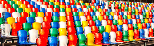 rows of colored plastic seats at the stadium
