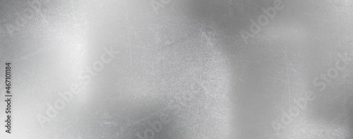 silver texture background with brushed metal shiny scratches effect © lumerb