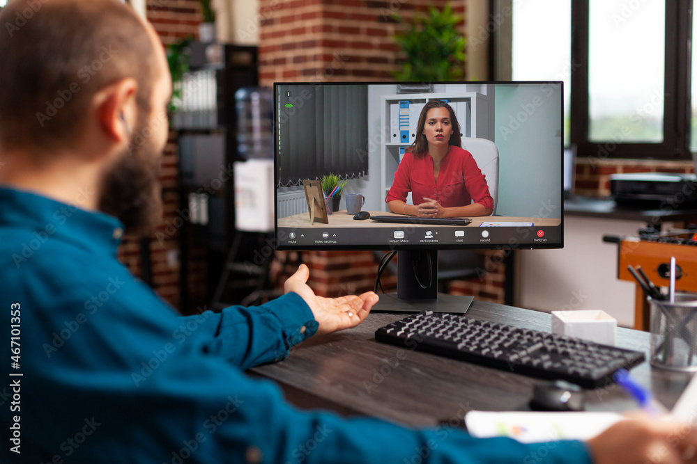 Businesswomam discussing management strategy with remote workmate during online videocall meeting conference on computer. Manager working at company presentation in startup office. Teleconference call Businesswomam discussing management strategy with remote workmate during online videocall meeting conference on computer. Manager working at company presentation in startup office. Teleconference call