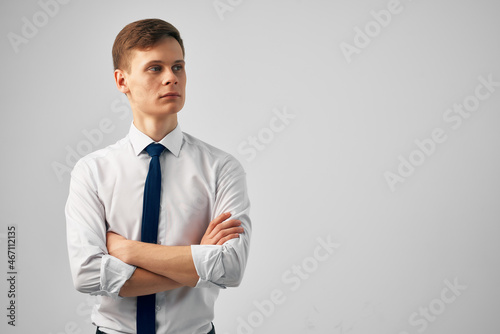 Cheerful man straightens his tie manager professional success