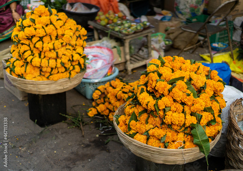 Garlands of marigold flower (Zendu) in market during Diwali festive season in Pune, India.  photo