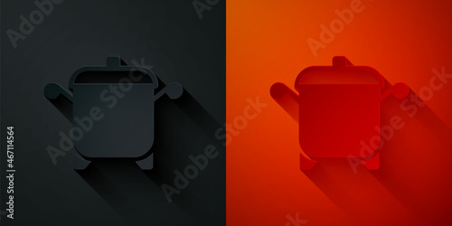 Paper cut Cooking pot icon isolated on black and red background. Boil or stew food symbol. Paper art style. Vector