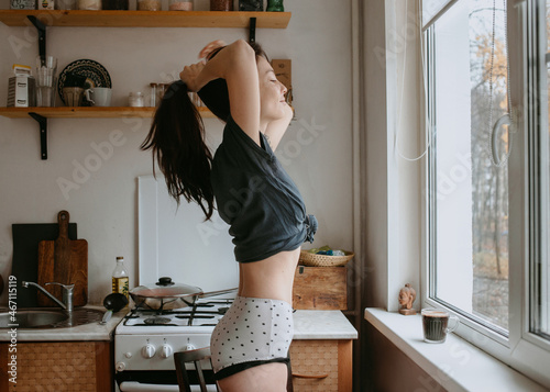 attractive woman on the kitchen in the morning