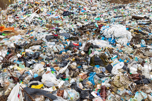 Verkhnie-Sergi, Russia - May 02, 2021. outdoor garbage dump. a lot of different waste thrown on the floor in a big heap