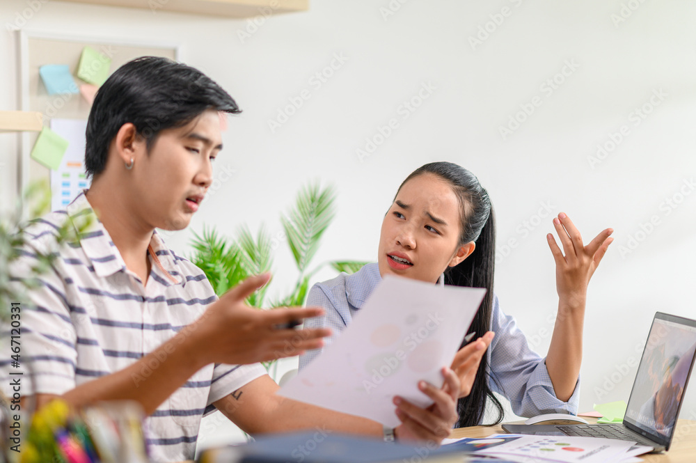 Male and female employees working together in the workplace Male and female employees working together in the workplace