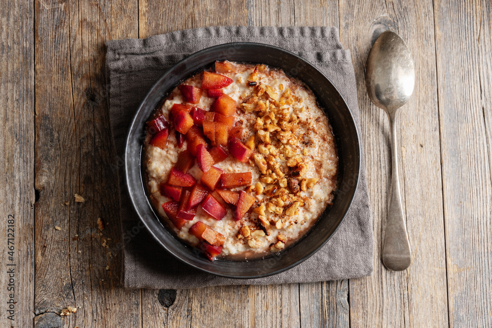 Porridge with plums walnuts and cinnamon Porridge with plums walnuts and cinnamon