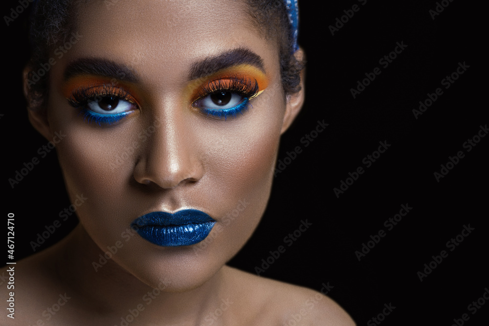 Beautiful dark-skinned girl with creative makeup close-up Beautiful dark-skinned girl with creative makeup close-up