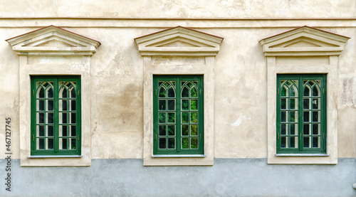 Three Symmetrical Green Vintage Windows