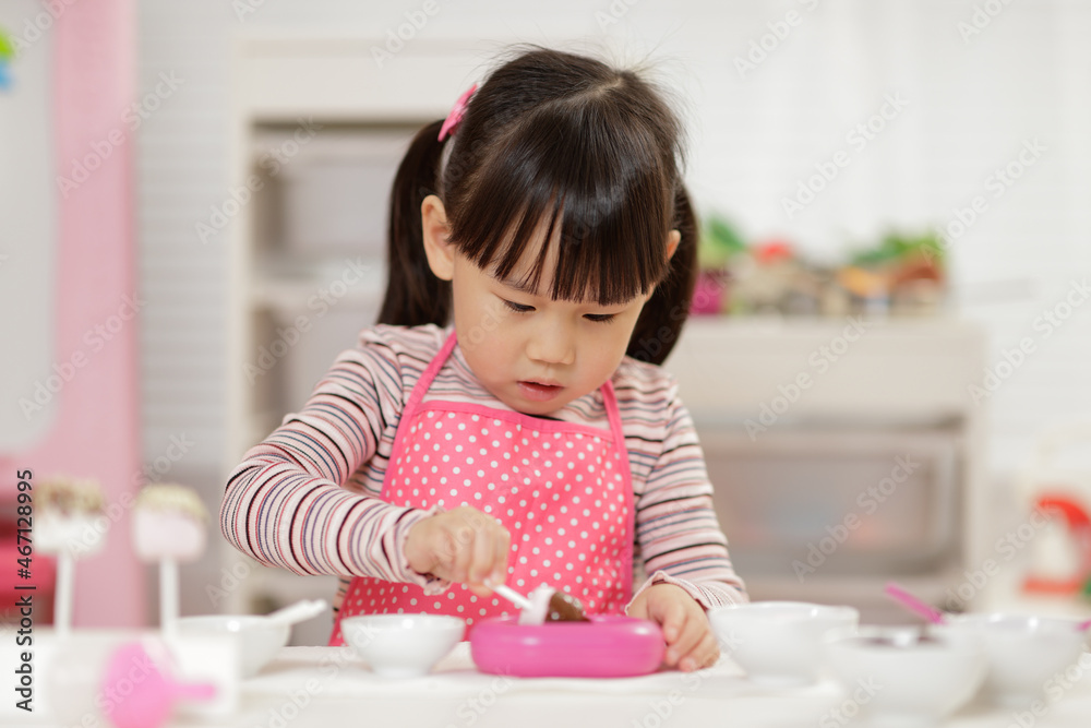 young girl pretend play food preparing at home young girl pretend play food preparing at home