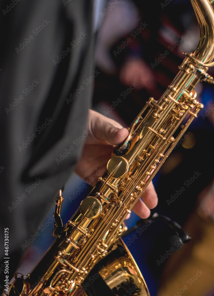 Fototapeta premium Man plays saxophone at concert
