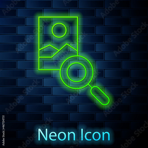 Glowing neon line Photo retouching icon isolated on brick wall background. Photographer, photography, retouch icon. Vector