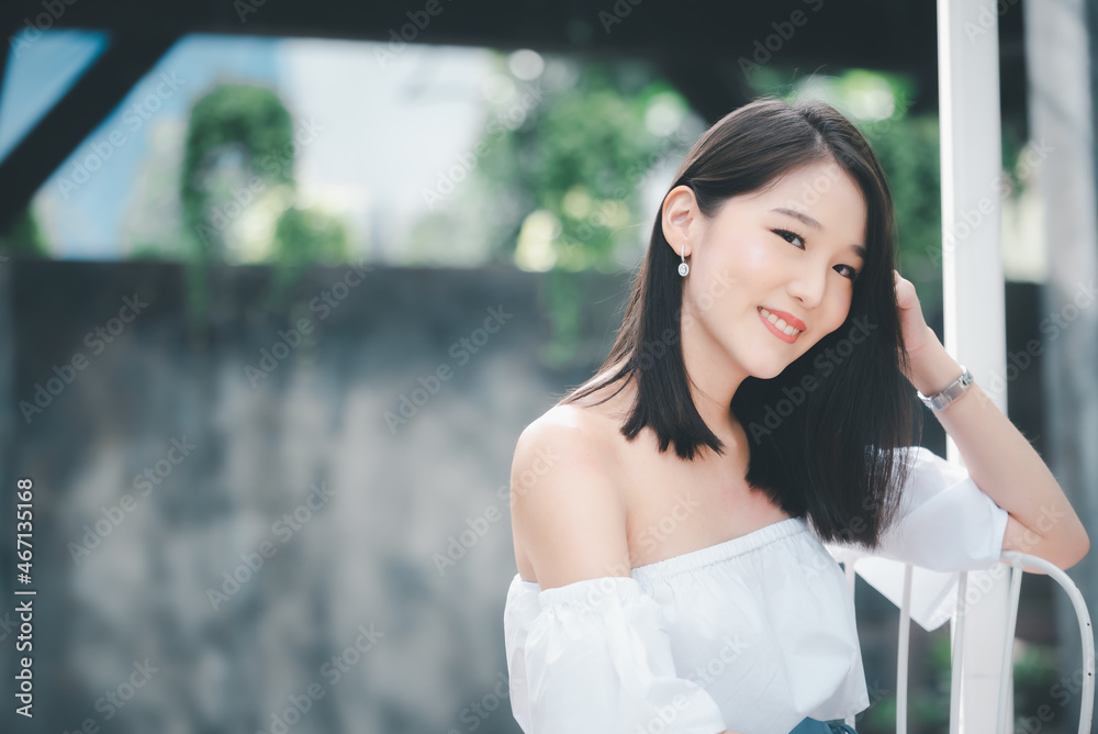 Portrait of young Asian beautiful cute girl in cafe, lifestyle concept
