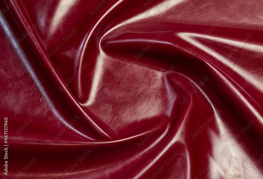 red artificial leather with waves and folds on PVC base