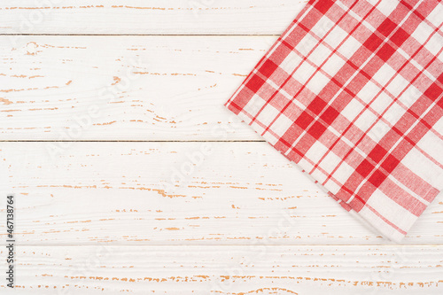 Red checkered tablecloth on a white wooden board