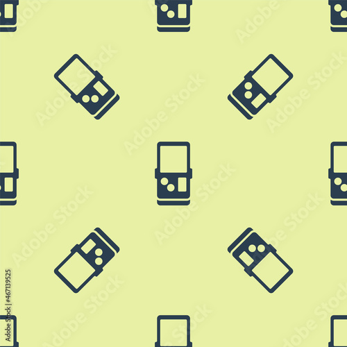Blue Portable tetris electronic game icon isolated seamless pattern on yellow background. Vintage style pocket brick game. Interactive playing device. Vector