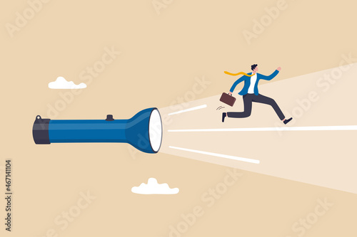 Business direction guidance, career path or solution to reach goal, mentorship, help and manager support, find the way concept, confidence businessman running forward on torch flashlight light beam.