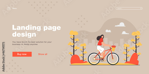 Happy girl riding bicycle at park flat vector illustration. Young funny woman doing sport at weekend. City, sky in background. Rider, bike with basket, outdoor activity, healthy lifestyle concept