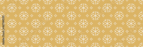 Background pattern with snowflakes and stars on a gold background for Christmas design. Seamless pattern
