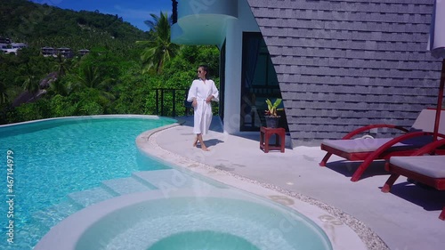 Beautiful Girl In Swimming Suit In Luxurious Villa Walking Into Infinity Pool 