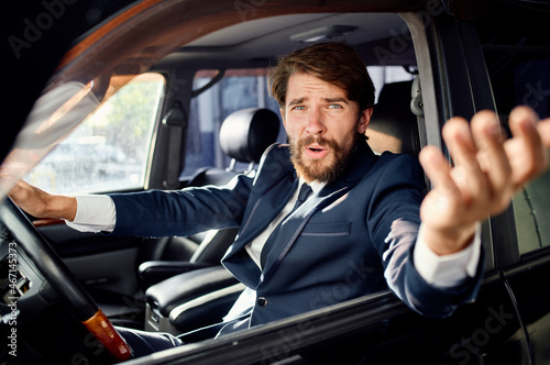 emotional man Driving a car trip luxury lifestyle success