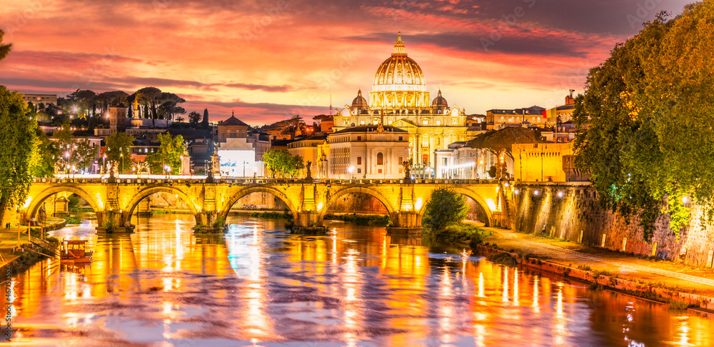 Red sunset in Rome with Tiber River and spirees of Vatican