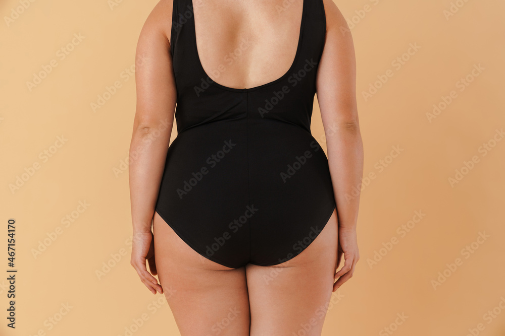 Young white woman wearing swimsuit posing on camera