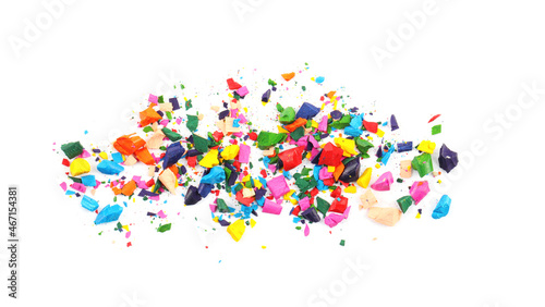 Colorful graphite crumbs on white background. Pencil sharpening