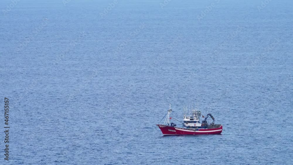 Aerial view of a fishing boat fishing in the Cantabrian Sea, Cantabria, Spain, Europe Aerial view of a fishing boat fishing in the Cantabrian Sea, Cantabria, Spain, Europe