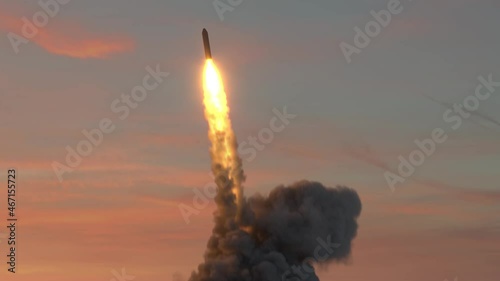 Ballistic missile launch from underwater at sunset photo