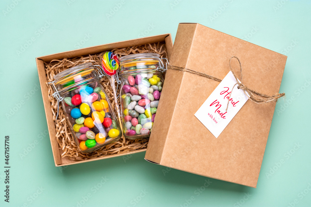 Obraz premium Handmade care package, seasonal gift box with candies, gingerbread, xmas decor Personalized eco friendly basket for family, friends, girl for thanksgiving, Christmas, mothers, fathers day Flat lay