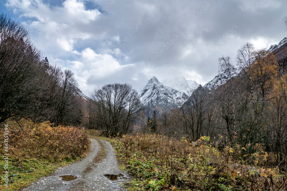 nature, landscape, mountains, rocks, snow, valley, gorge, forest, trees, fir trees, grass, foliage, road, stones, puddles, reflections, expanse, autumn, day, sky, clouds, clouds, light, shadow, walk