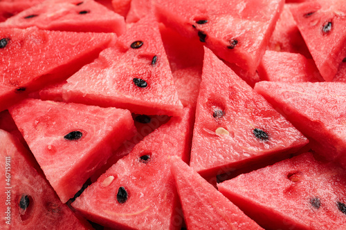 Delicious fresh watermelon slices as background, closeup