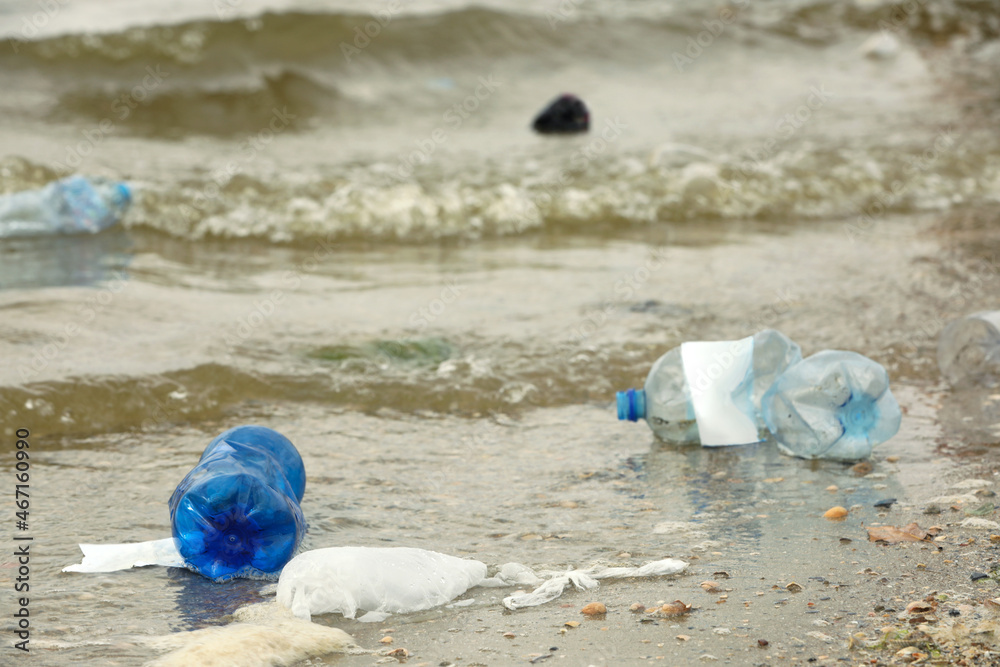 Beach polluted with plastic garbage. Ecological problem Beach polluted with plastic garbage. Ecological problem