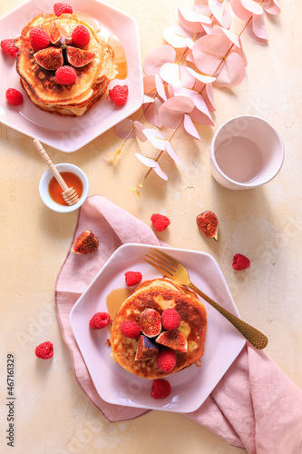 Sweet curd cheese pancakes with fresh raspberry, figs and maple sirup