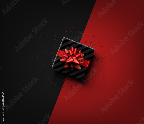 Black square sriped gift box with red bow.