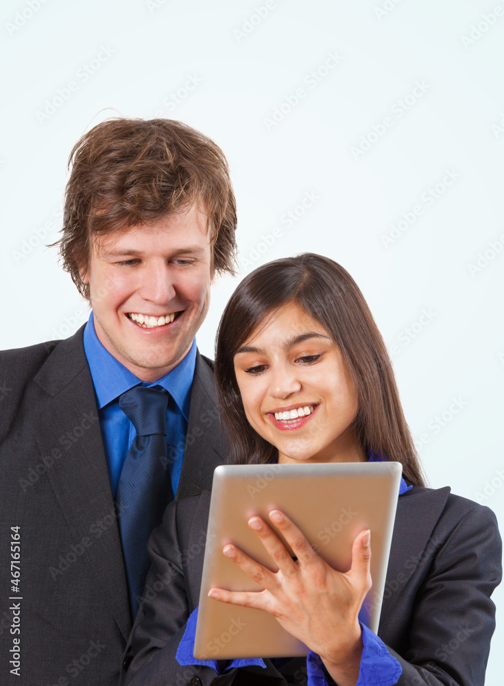 Two businesspeople looking on a touchpad - isolated Two businesspeople looking on a touchpad - isolated