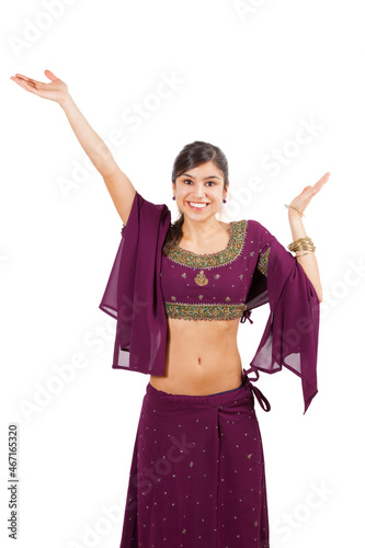 Beautiful indian young brunette dancing
