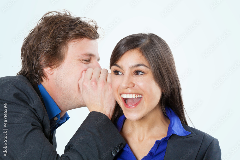 Business colleagues sharing a secret Business colleagues sharing a secret