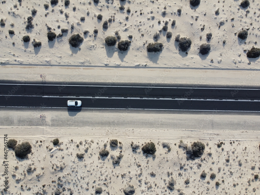 Aerial top view of roads through sand dunes in Corralejo, Fuerteventura, Canarian Islands Aerial top view of roads through sand dunes in Corralejo, Fuerteventura, Canarian Islands
